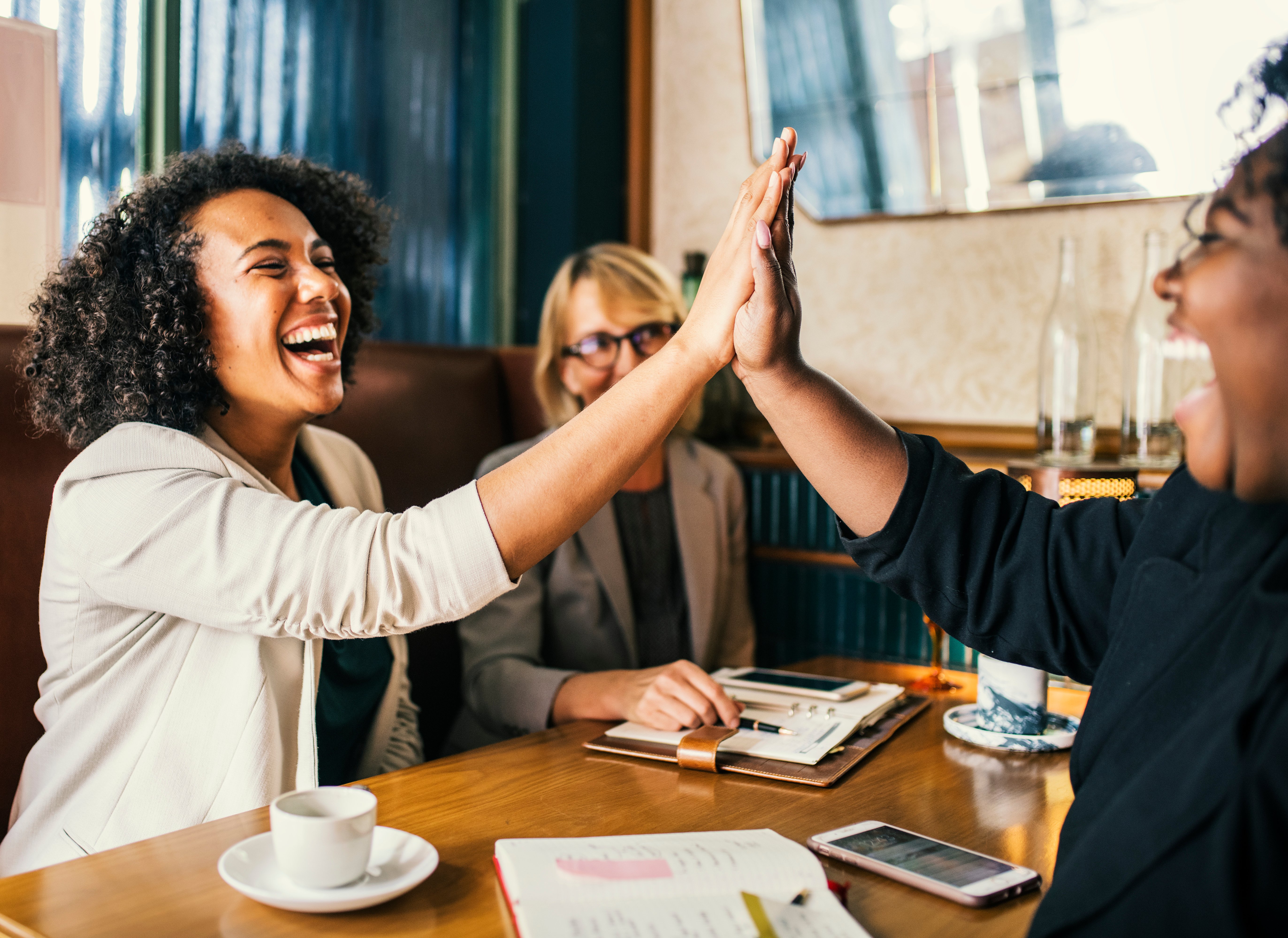 succesful-businesswomen-giving-a-high-five-2025-02-11-05-09-33-utc